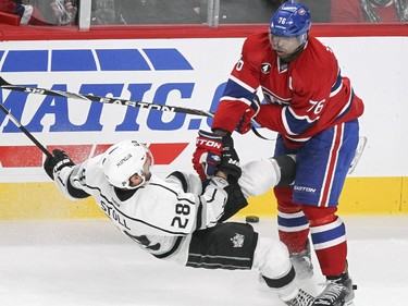 Montreal Canadiens P.K Subban levels Los Angeles Kings Jarret Stoll with a check during third period of National Hockey League game in Montreal Friday December 12, 2014.