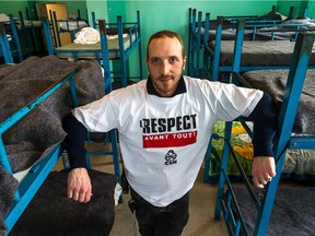 Old Brewery Mission employee Vincent Ozrout, amid the beds at the mission in Montreal, on Dec. 12, 2014. He often works over the Christmas holidays.