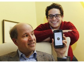 Richard Janda, left, a law professor at McGill and student Juan Pinto, right, show a new app which promote sustainable choices.