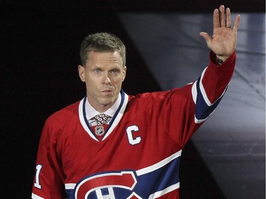 Former Montreal Canadiens captain Saku Koivu acknowledges ovation from fans prior to National Hockey League game between the Habs and the Anaheim Ducks in Montreal Thursday December 18, 2014.