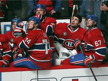 Montreal Canadiens, from left, Tomas Plekanec, P.K. Subban, P.A. Parenteau, Alexei Emelin, Andrei Markov, Carey Price and Max Pacioretty watch video tribute to former captain Saku Koivu during ceremony prior to National Hockey League game between the Habs and the Anaheim Ducks in Montreal Thursday December 18, 2014.