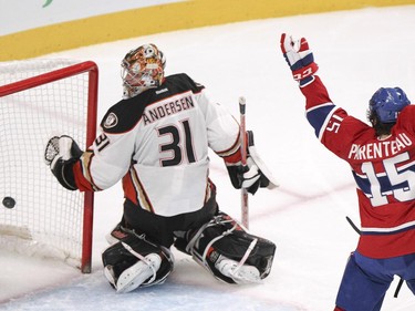 Montreal Canadiens P.A. Parenteau celebrates teammate David Desharnais's goal against Anaheim Ducks goalie Frederik Andersen during third period of National Hockey League in Montreal Thursday December 18, 2014.