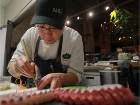 Chef Antonio Park works on a sashimi platter at his Park restaurant. He is about to become a judge on a television show, Chopped Canada, and is opening a new restaurant.