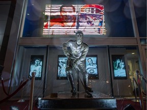 An illuminated statue of Canadiens legend Jean Béliveau outside the Bell Centre in Montreal on Dec. 3, 2014, the day after the Hockey Hall of Famer died at age 83.