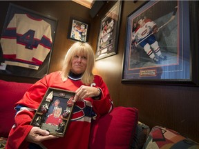 Cheryl Nashen in her den with Jean Béliveau hockey memorabilia. Nashen invited Béliveau to her wedding years ago and also to her daughter's first birthday party. He couldn't make either, but sent hand-written notes, which she kept.