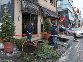 Montreal police arson investigators at La Cantina restaurant in Ahuntsic-Cartierville, Dec. 3, 2014, after it was firebombed the night before, causing significant damage.