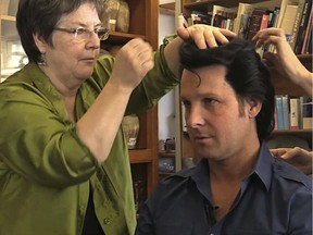 Rachel Tremblay, left, make adjustments on a wig worn by Jay Dupuis, right, an Elvis impersonator. Rachel runs Cybele Perruques, a wig maker for people like the Cirque du Soleil and several Elvis impersonators.
