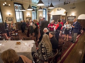 MMembers of the University Club mingle during the Christmikah event on Dec. 4.