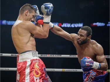 Jean Pascal of Laval, right, exchanges punches with Roberto Bolonti of Argentina, left, during their light heavyweight main event fight at the Bell Centre in Montreal on Saturday, December 6, 2014.
