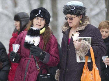 Marchers participate in a candlelight procession to the Mont Royal Chalet in Montreal, Saturday December 6, 2014.  It was part of a day of commemorations to mark the 25th anniversary of the murder of 14 women at the École Polytechnique, by Marc Lépine.