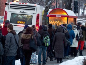 File photo: STM commuters line up in Montreal on Monday, February 4, 2013.