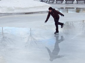 Phillip Tsakonas' reflection follows his skating performance at Beaver Lake Jan. 14, 2013.