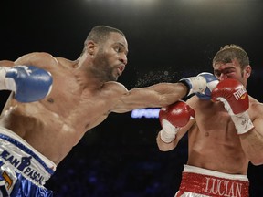 Jean Pascal connects with a punch against Lucian Bute during their North American Boxing Federation light-heavyweight title fight at the Bell Centre on Jan. 19, 2014. Pascal won by a unanimous decision.