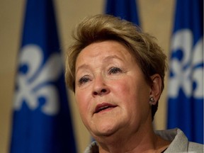 PQ leader Pauline Marois speaks with the press at Montreal city hall in Montreal, on Sunday, March 16, 2014 after she met with Montreal mayor Denis Coderre.