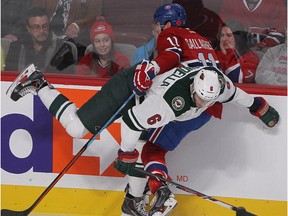 N.D.G. native Marco Scandella of the Minnesota Wild checks the Canadiens' Brendan Gallagher into the boards during game at the Bell Centre on Nov. 8, 2014.