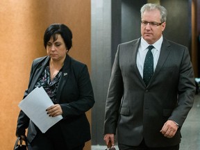 Psychiatrist Gilles Chamberland, right, during a break for the trial of Luka Magnotta at the Montreal courthouse in Montreal on Tuesday, November 18, 2014. Magnotta is charged in connection with the killing and dismemberment of Chinese student Lin Jun. (Dario Ayala / Montreal Gazette)