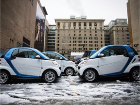 Vehicles from the car-sharing company Car2Go parked on the corner of de Maisonneuve boulevard and Mansfield street in Montreal, on Wednesday, November 27, 2013.
