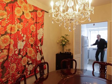 A kimono hangs on the wall of the dining area of the home of Peter Loorits.