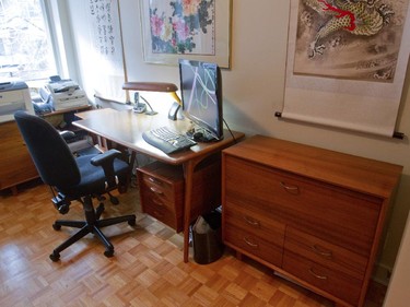Wooden office furniture made by Peter Loorits's father, in the office.