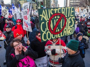 People take part in an anti-austerity protest in downtown Montreal on Saturday.