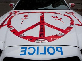 For months, police cars have been plastered with stickers protesting changes to the public pension plan.