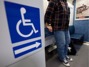 A woman who wears braces on her legs for support, is seen inside an AMT train at the Lucien-l'Allier commuter station in downtown Montreal on Thursday, October 21, 2010.