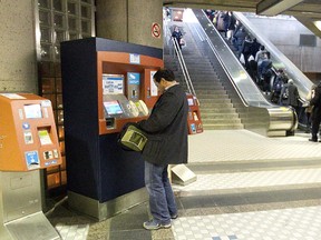 A Montreal transit user at an Opus machine at the St-Michel métro station on Tuesday October 23, 2012.