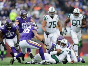New York Jets quarterback Geno Smith slides after a scramble during game against the Minnesota Vikings on Dec. 7, 2014 at TCF Bank Stadium in Minneapolis. The Vikings defeated the Jets 30-24.