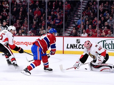 Robin Lehner of the Ottawa Senators stops the puck on a shot by Tomas Plekanec of the Montreal Canadiens during the NHL game at the Bell Centre on December 20, 2014, in Montreal.
