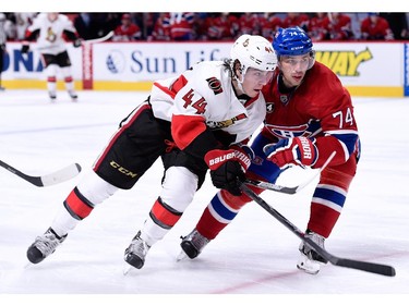 Alexei Emelin of the Montreal Canadiens and Jean-Gabriel Pageau of the Ottawa Senators skate during the NHL game at the Bell Centre on December 20, 2014, in Montreal.