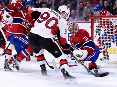 Alex Chiasson of the Ottawa Senators shoots the rebounding puck wide on Carey Price of the Montreal Canadiens during the NHL game at the Bell Centre on December 20, 2014, in Montreal.