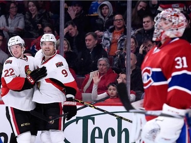 Erik Condra  of the Ottawa Senators celebrates his first period goal with teammate Milan Michalek during the NHL game against the Montreal Canadiens at the Bell Centre on December 20, 2014, in Montreal.
