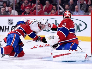 Erik Condra of the Ottawa Senators tips the puck past Carey Price of the Montreal Canadiens to score during the NHL game at the Bell Centre on December 20, 2014, in Montreal.