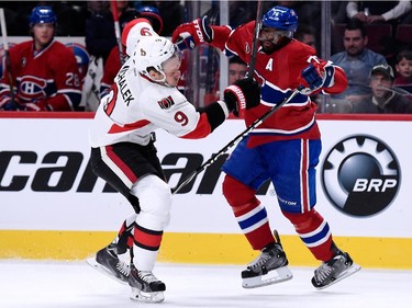 P.K. Subban of the Montreal Canadiens and Milan Michalek of the Ottawa Senators collide during the NHL game at the Bell Centre on December 20, 2014, in Montreal.