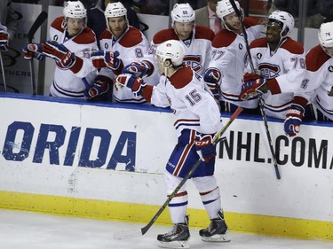 Montreal Canadiens right wing P.A. Parenteau (15) is congratulated by his teammates after scoring during the shootout in an NHL hockey game against the Florida Panthers, Tuesday, Dec. 30, 2014, in Sunrise, Fla. The Canadiens won 2-1.