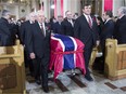 Pallbearers and former teammates (left to right) Jean-Guy Talbot, Phil Goyette, Yvan Cournoyer, Guy Lafleur and Serge Savard carry the casket of former Canadiens captain Jean Béliveau into his funeral service at Mary, Queen of the World Cathedral in Montreal on Dec.10, 2014.
