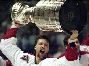 Patrick Roy holds the Stanley Cup aloft after leading the Canadiens to victory in 1993.