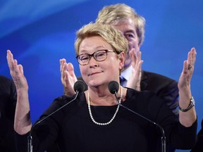 In this file photo from April 7, 2014, then PQ leader Pauline Marois takes the stage after her party was defeated in the provincial election. Quebec premier Philippe Couillard said Wednesday that the system of providing an allowance of $200,000 a year for three years to former premiers is under review.