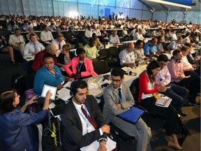 Members of representative commissions of the countries participating in the climate change conferences, attend the seventh plenary meeting of the COP20 on December 13, 2014 in Lima, as they continue working on a final document draft. The UN 20th session of the Conference of the Parties on Climate Change (COP20) and the 10th session of the Conference of the Parties serving as the Meeting of the Parties to the Kyoto Protocol (CMP10), which should have finished Friday, extended their negotiations Saturday.