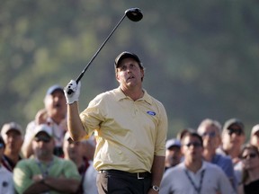 In this June 18, 2006, file photo, Phil Mickelson reacts to an errant drive on the 18th hole during the final round of the U.S. Open at Winged Foot Golf Club in Mamaroneck, N.Y.