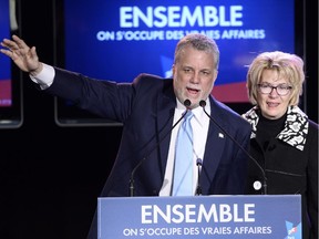 Quebec Liberal leader Philippe Couillard and his wife Suzanne Pilote take the stage after winning the provincial election Monday April 7, 2014 in St-Felicien, Que.