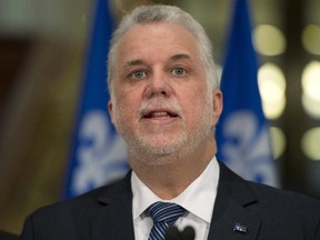 Quebec Premier Philippe Couillard speaks at a news conference marking the end of the fall session Friday, December 5, 2014 at the legislature in Quebec City.