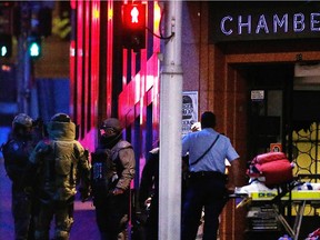 SYDNEY, AUSTRALIA - DECEMBER 16:  Anti-explosive police officers talk next to the Lindt Cafe, Martin Place during a hostage standoff on December 16, 2014 in Sydney, Australia. Police stormed the Sydney cafe after a gunman had taken hostages, ending the standoff.