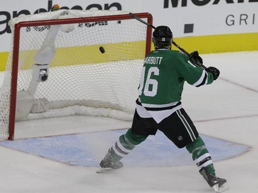 Dallas Stars left wing Ryan Garbutt (16) scores an open net goal during the third period of an NHL hockey game against the Montreal Canadiens Saturday, Dec. 6, 2014, in Dallas. The Stars won 4-1.