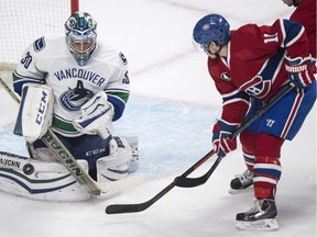 Vancouver Canucks goalie Ryan Miller stops Montreal Canadiens' Brendan Gallagher during first period NHL hockey action Tuesday, December 9, 2014 in Montreal.
