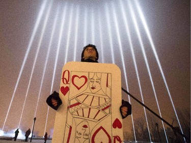 Sebastien Duran stands in front of a commemorative display of lights for the victims during a ceremony on Mount Royal to mark the 25th anniversary of the Polytechnique massacre Saturday, December 6, 2014 in Montreal. It was 25 years ago today that a gunman shot and killed 14 women before taking his own life at theÉcole Poytechnique of the Université de Montréal.