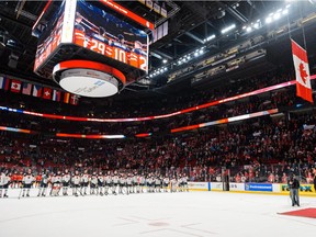 The Canadian flag is raised to the rafters at the end of Team Canada's 8-0 victory over Slovakia at the Bell Centre on Dec. 26, 2014 in preliminary round of the World Junior Hockey Championship.