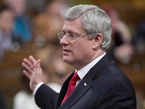 Canadian Prime Minister Stephen Harper responds to a question during question period in the House of Commons in Ottawa on December 3, 2014.
