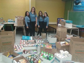 Students at Lester B. Pearson High School in Montreal North collected items for a community organization as part of a Grade 11 ethics project. Pictured here are Maria Cammisani, Nina McGregor, Tania Daluiso and Adriana Arcaro.
