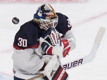 USA's goaltender Thatcher Demko looses sight of the puck as he makes a save while facing Canada during first period preliminary round hockey action at the IIHF World Junior Championship, Wednesday, December 31, 2014 in Montreal.